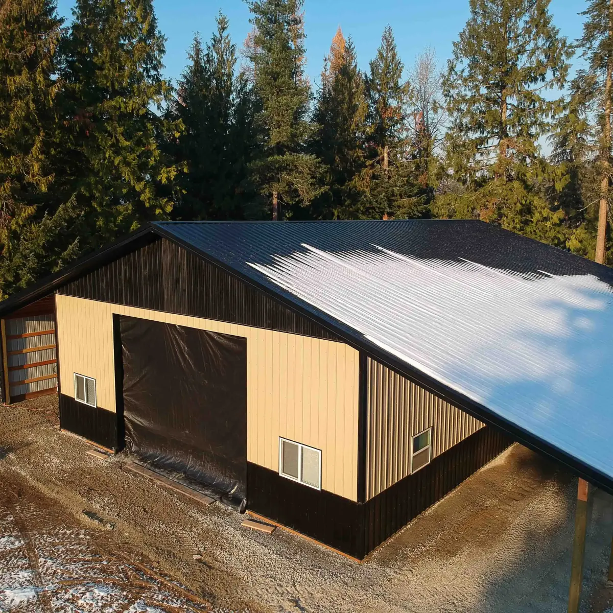 One of our recent pole building projects. Seen here without the garage door installed.